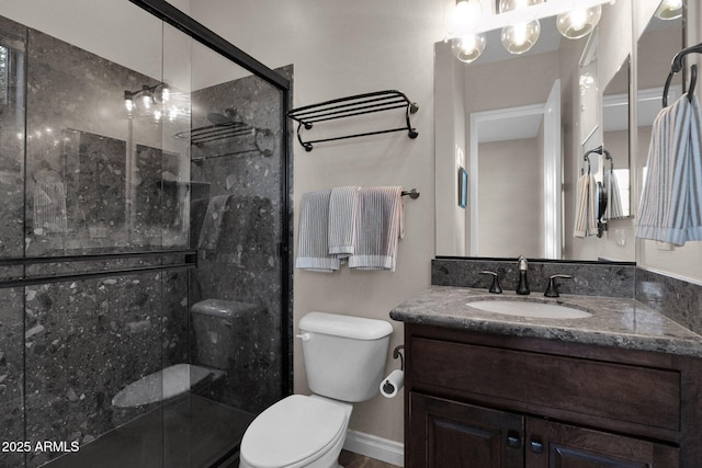 bathroom featuring vanity, a shower with shower door, a notable chandelier, and toilet