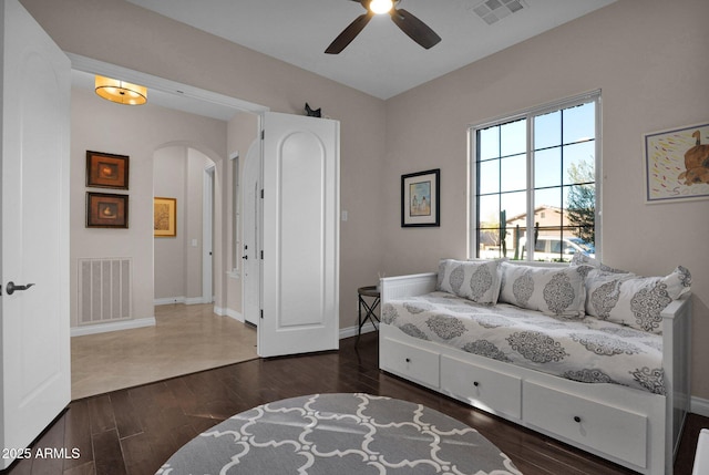 sitting room with ceiling fan and dark hardwood / wood-style flooring