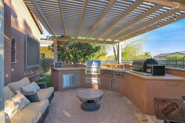 view of patio / terrace with sink, a pergola, area for grilling, and a grill