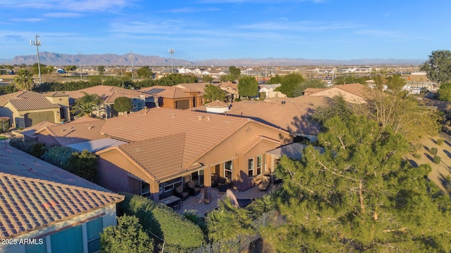 birds eye view of property featuring a mountain view