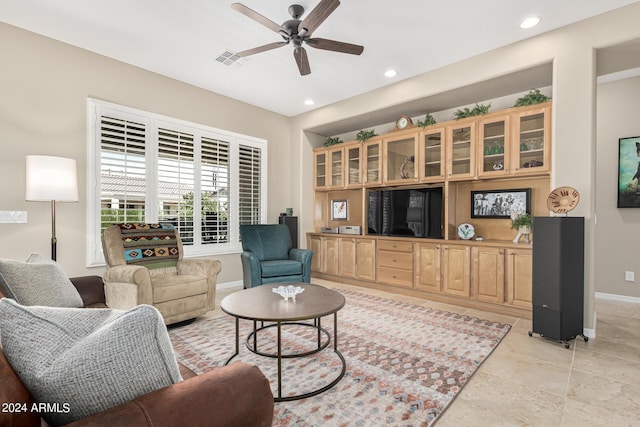 living area with baseboards, recessed lighting, visible vents, and a ceiling fan