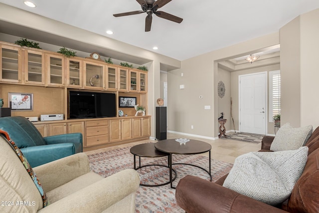 living room with light tile patterned floors, ceiling fan, baseboards, and recessed lighting