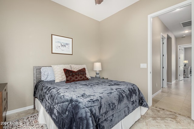 bedroom featuring visible vents and baseboards