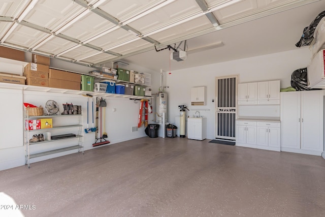 garage featuring a garage door opener and gas water heater