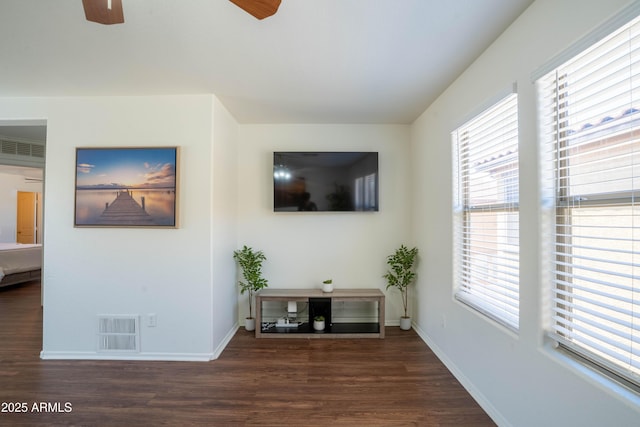 8516 N 64th Ave, Glendale, AZ 85302 - living area featuring a ceiling fan, wood finished floors, and baseboards