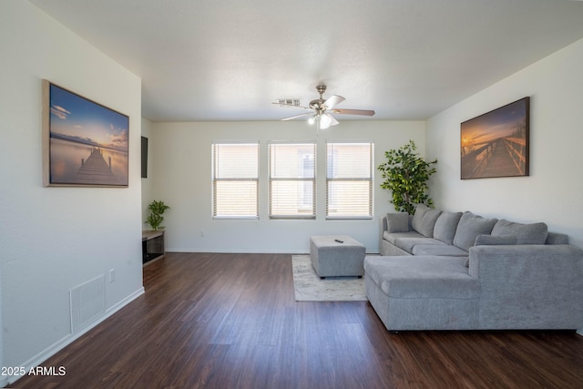 8516 N 64th Ave, Glendale, AZ 85302 - living area featuring ceiling fan, dark wood-style flooring, and baseboards