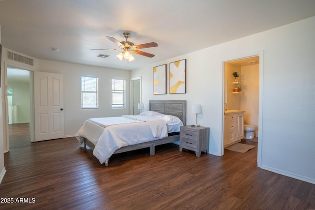 8516 N 64th Ave, Glendale, AZ 85302 - bedroom featuring dark wood finished floors, baseboards, ceiling fan, and connected bathroom