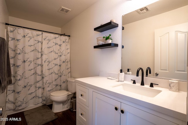 8516 N 64th Ave, Glendale, AZ 85302 - bathroom with toilet, wood finished floors, and vanity