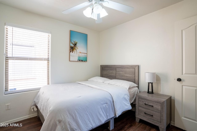 8516 N 64th Ave, Glendale, AZ 85302 - bedroom with dark wood-style floors, multiple windows, and baseboards