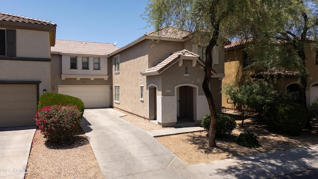 8516 N 64th Ave, Glendale, AZ 85302 - view of front facade with stucco siding, driveway, an attached garage, and a tiled roof