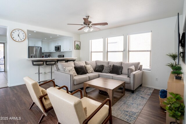8516 N 64th Ave, Glendale, AZ 85302 - living room with ceiling fan, healthy amount of natural light, and baseboards