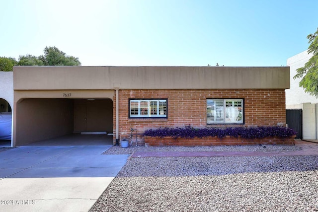 view of front of house with a carport