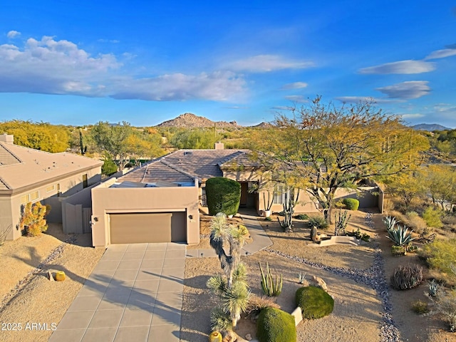 birds eye view of property with a mountain view