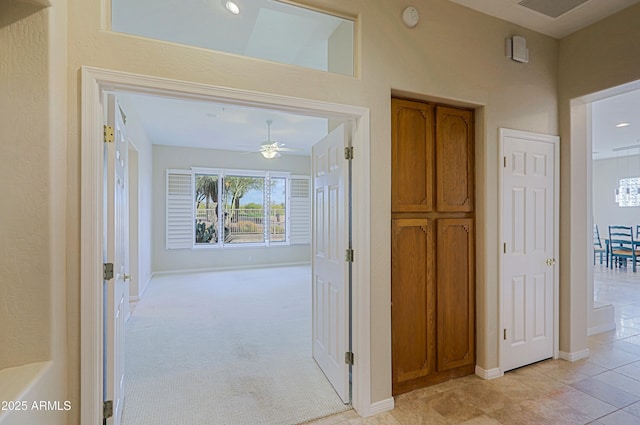 corridor with light carpet