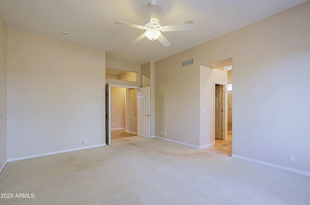 carpeted empty room featuring ceiling fan