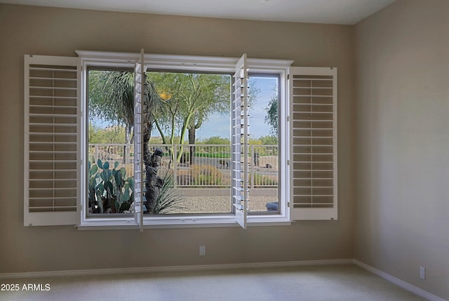 unfurnished room featuring carpet floors