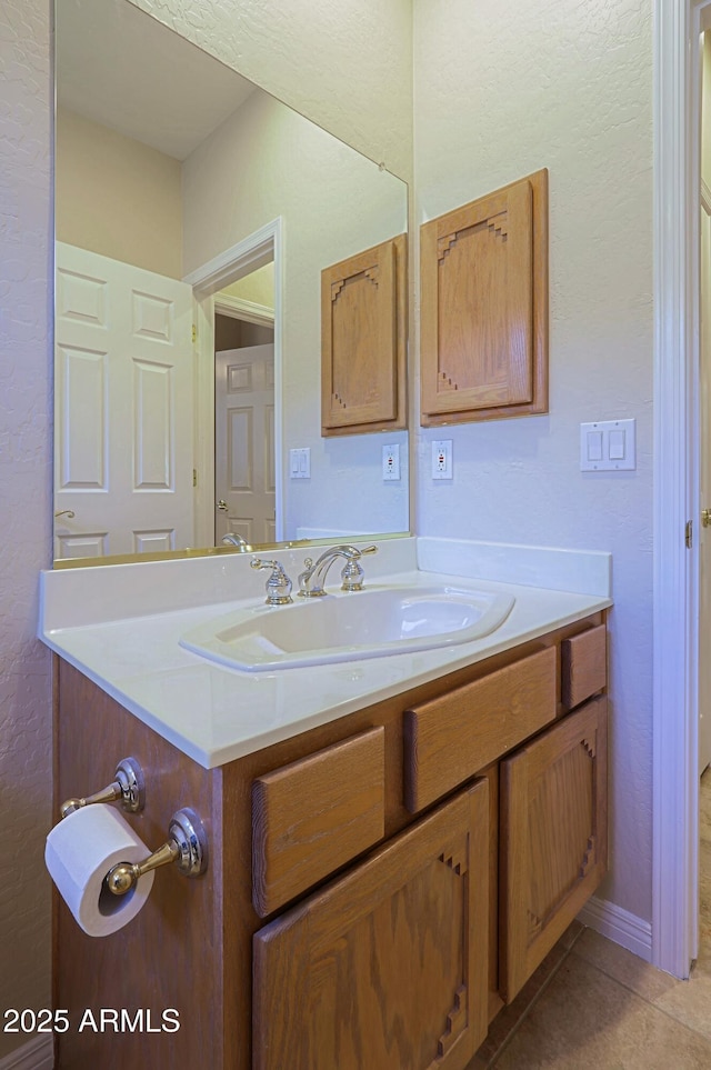 bathroom with vanity and tile patterned floors