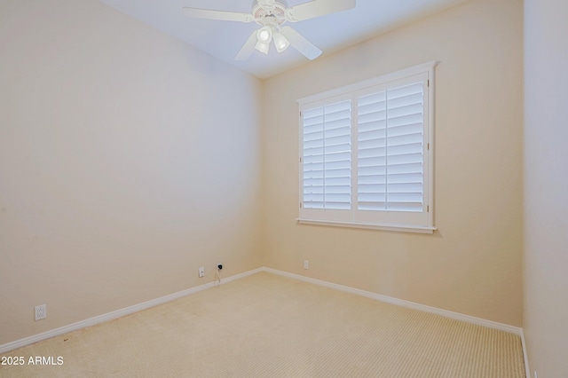 unfurnished room with ceiling fan and light carpet