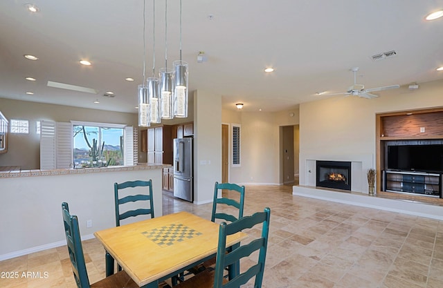 dining space with ceiling fan