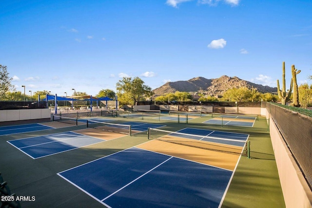 view of tennis court with a mountain view