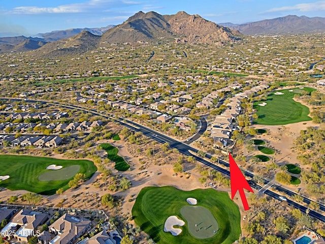 birds eye view of property with a mountain view