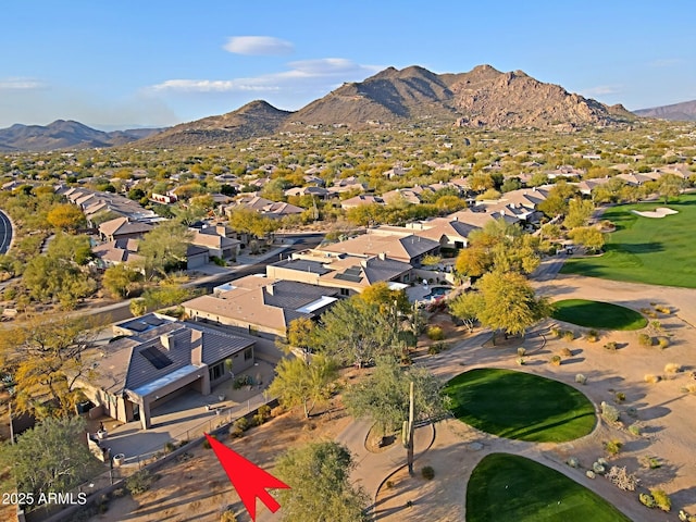 birds eye view of property with a mountain view