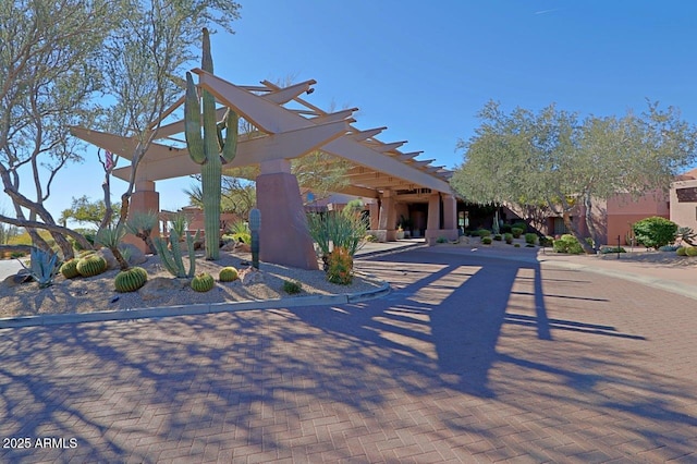 view of home's community featuring a pergola