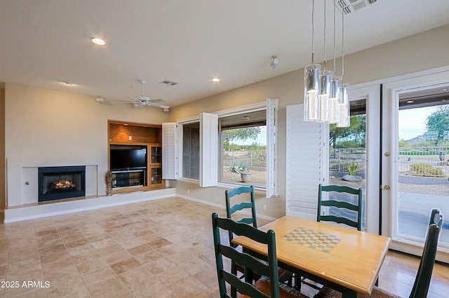 dining room featuring ceiling fan