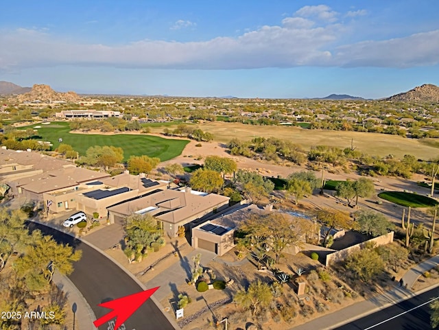 birds eye view of property featuring a mountain view