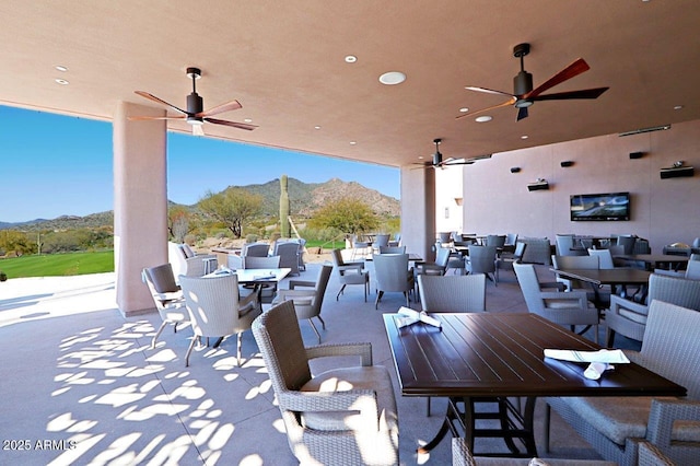 view of patio featuring ceiling fan