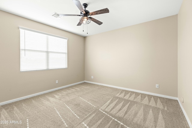 unfurnished room featuring ceiling fan and carpet