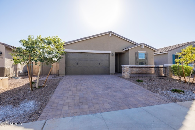 ranch-style home featuring a garage