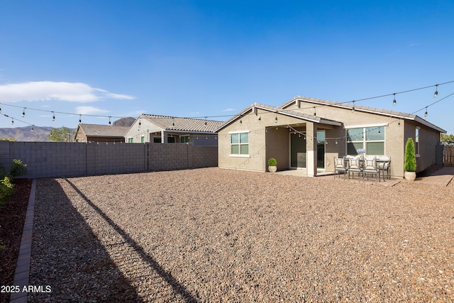 back of house featuring a patio