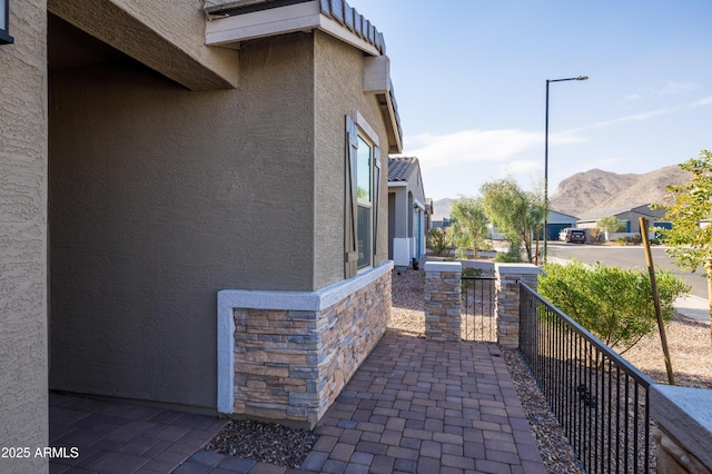 view of side of property with a mountain view