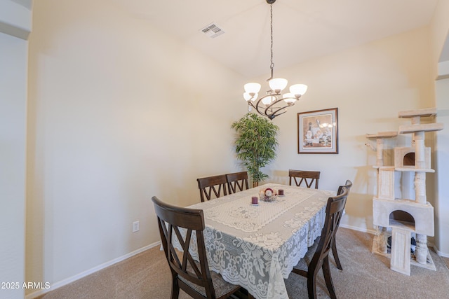 dining area featuring carpet floors, baseboards, an inviting chandelier, and visible vents