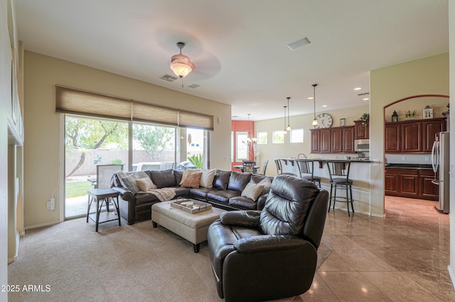 living room with recessed lighting, plenty of natural light, visible vents, and a ceiling fan