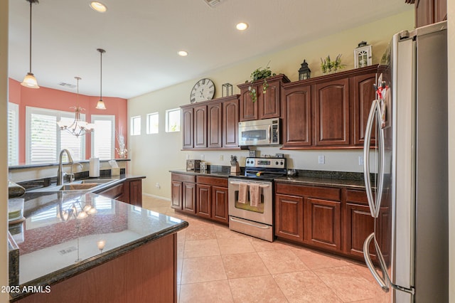 kitchen featuring an inviting chandelier, light tile patterned floors, visible vents, appliances with stainless steel finishes, and a sink