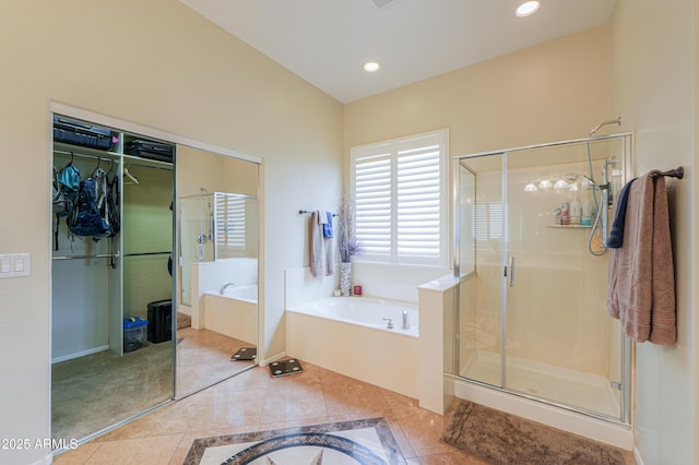 full bathroom featuring a shower stall, a bath, tile patterned flooring, and recessed lighting