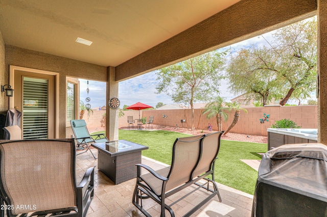 view of patio / terrace with an outdoor fire pit, a fenced backyard, and area for grilling