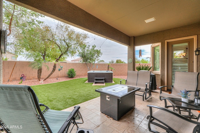 view of patio with a fire pit and a fenced backyard