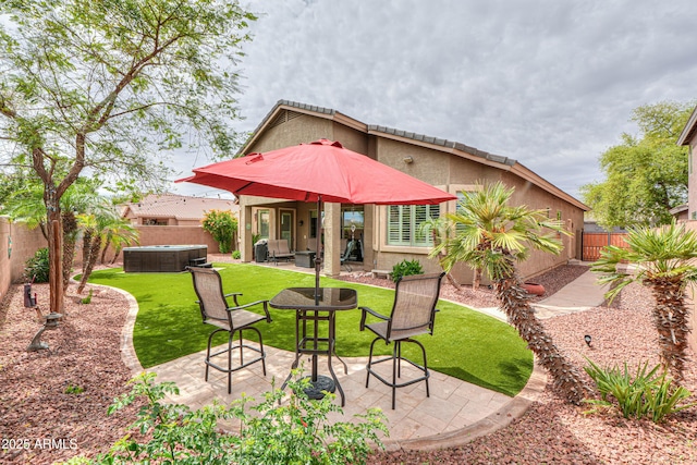 rear view of property with a patio area, a fenced backyard, a lawn, and stucco siding