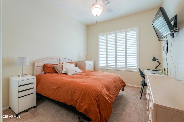 bedroom with light colored carpet, baseboards, and visible vents