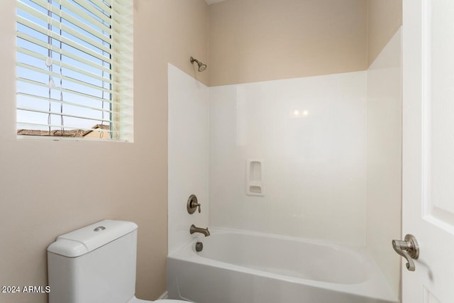 bathroom with toilet and shower / bath combination