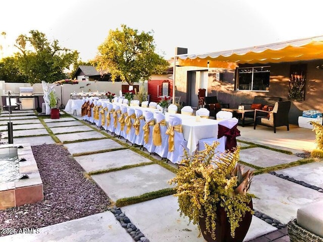 exterior space featuring a patio area and outdoor lounge area