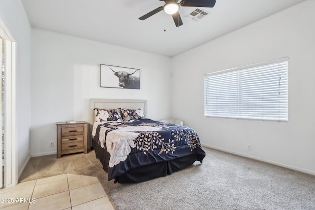 bedroom featuring carpet, baseboards, and a ceiling fan