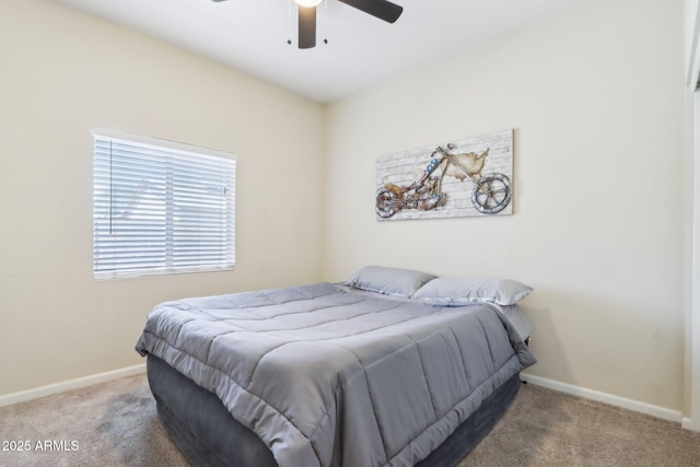 bedroom with carpet flooring, baseboards, and a ceiling fan