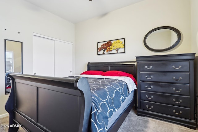 bedroom with carpet floors and a closet