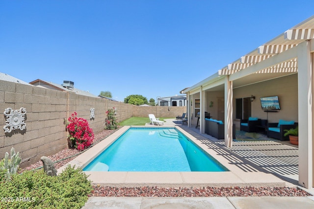 view of swimming pool featuring a patio, a fenced backyard, and an outdoor living space
