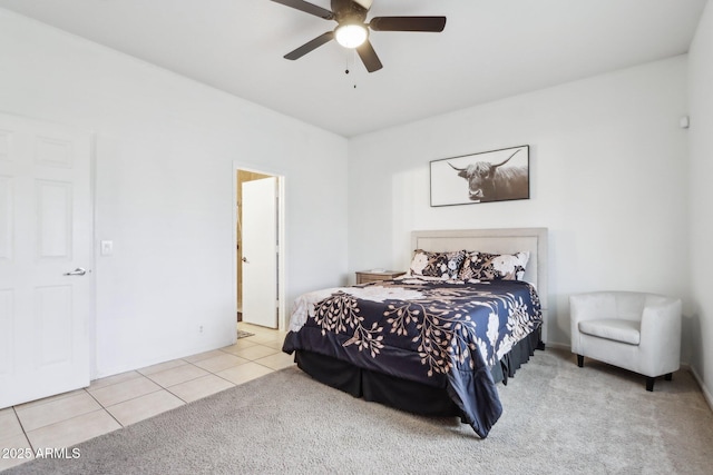 bedroom featuring tile patterned flooring, carpet flooring, and ceiling fan