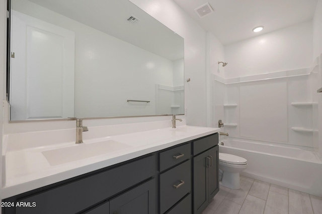 full bathroom featuring vanity,  shower combination, and toilet